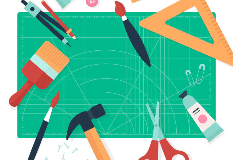 Illustration von einer Schreibtischunterlage und unterschiedlichen Schreibmaterialien