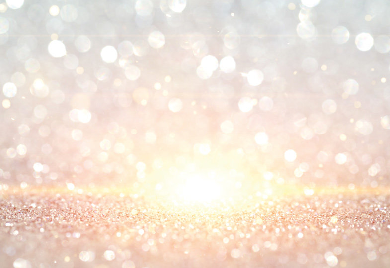 Glitzerstaub reflektiert von Sonnenstrahl