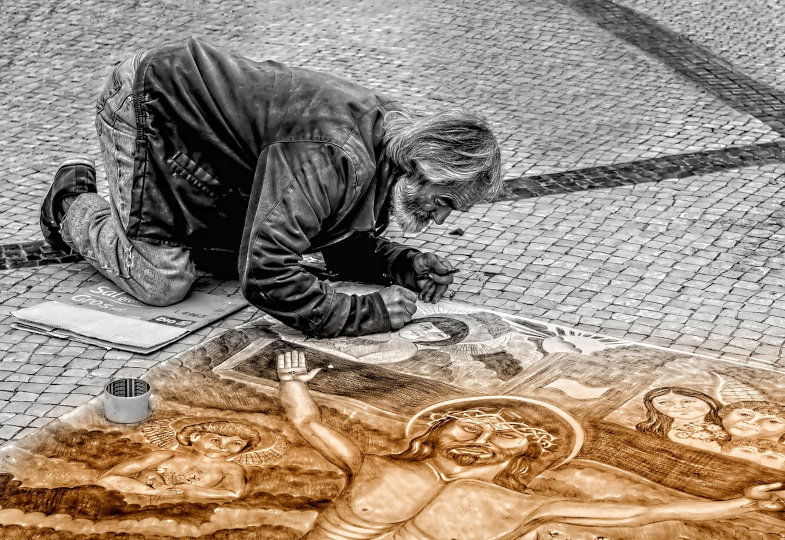 Straßenmaler malt Christus