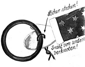 Zeichnung einer Holzhand, an der ein Ring mithilfe eines Drahts befestigt ist.