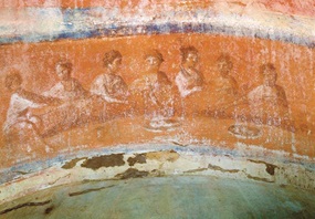 Jeder und jede ist willkommen: Auf dieser frühchristlichen Wandmalerei kommen Männer und Frauen zum Brotbrechen zusammen (Foto: picture alliance / André Held).
